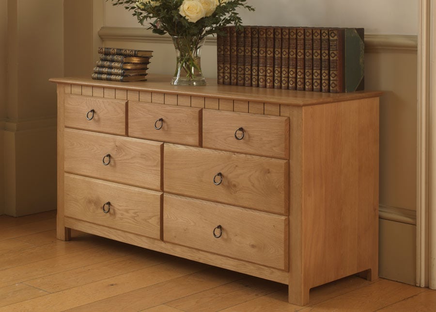 Wide oak chest on sale of drawers